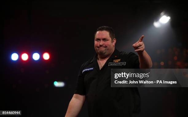Alan Norris celebrates winning a leg during the BDO World Championships Final at the Lakeside Complex, Surrey.