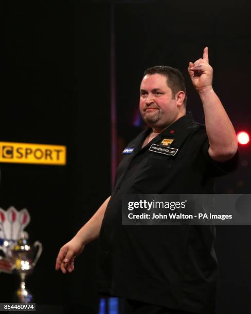 Alan Norris celebrates a leg during the BDO World Championships Final at the Lakeside Complex, Surrey.