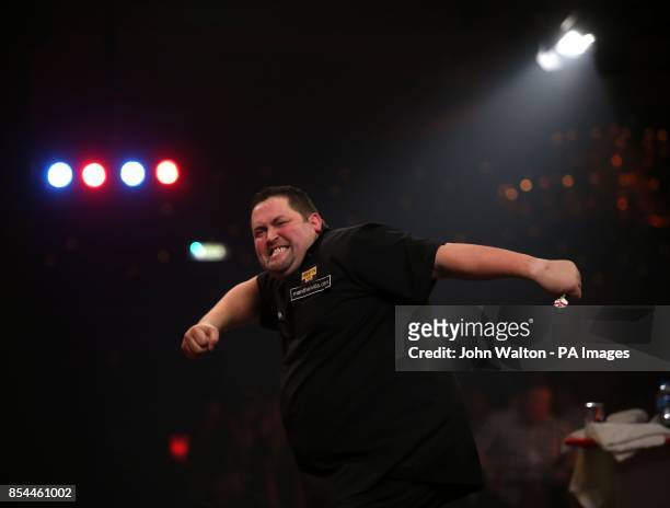 Alan Norris celebrates winning a leg during the BDO World Championships Final at the Lakeside Complex, Surrey.