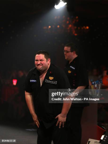 Alan Norris screws up his face in dejection moments before losing the match to Stephen Bunting during the BDO World Championships Final at the...