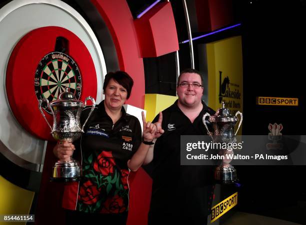Stephen Bunting and Lisa Ashton celebrate with their trophy's during the BDO World Championships Final at the Lakeside Complex, Surrey.