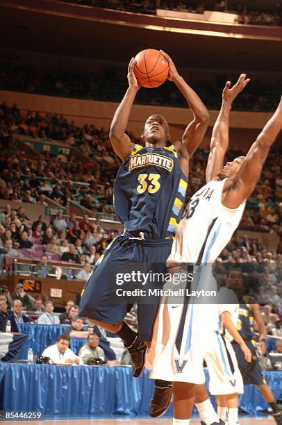 Jimmy Butler of the Marquette Golden Eagles goes to ht e basket during a quarterfinal Big East Conferance Tournament college basketball game against...