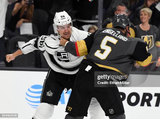 Kurtis MacDermid of the Los Angeles Kings and Deryk Engelland of the Vegas Golden Knights fight in the first period of their preseason game at...