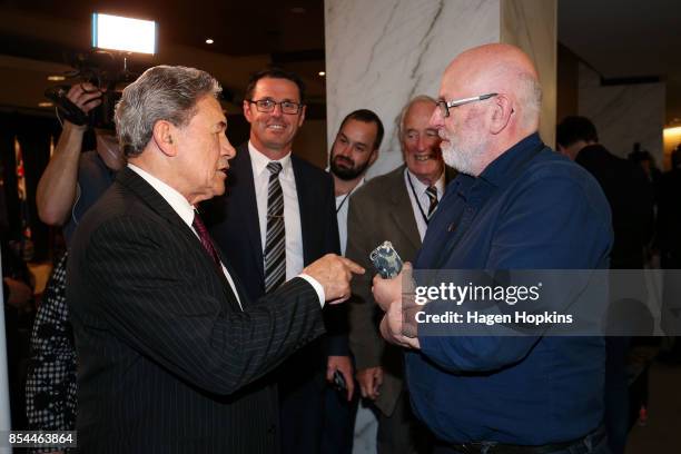 First leader Winston Peters speaks to journalist Vernon Small after a press conference at the Beehive Theatrette on September 27, 2017 in Wellington,...