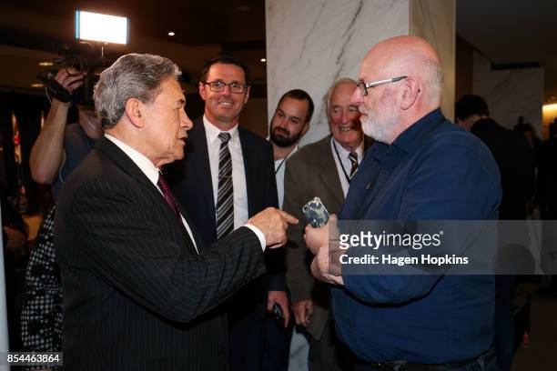 First leader Winston Peters speaks to journalist Vernon Small after a press conference at the Beehive Theatrette on September 27, 2017 in Wellington,...