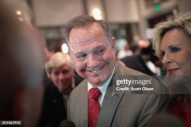 Republican candidate for the U.S. Senate in Alabama, Roy Moore speaks to reporters at an election-night rally after declaring victory on September...