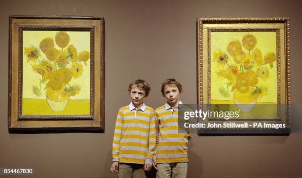 A pair of Vincent Van Gogh's Sunflower paintings hang side-by-side
