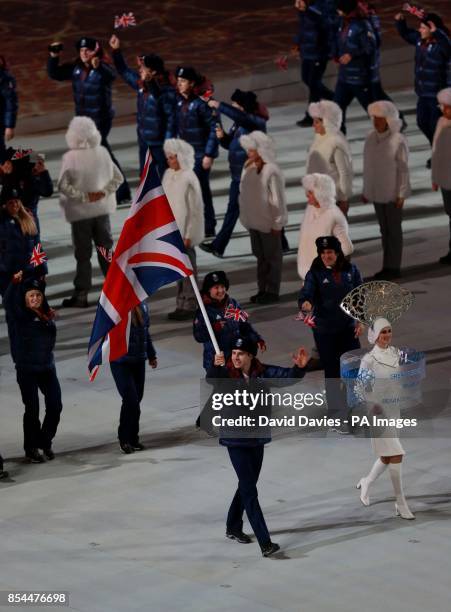 Great Britain's Jonathan Eley leads his team mates out during the Opening Ceremony for the 2014 Sochi Olympic Games in Sochi, Russia.