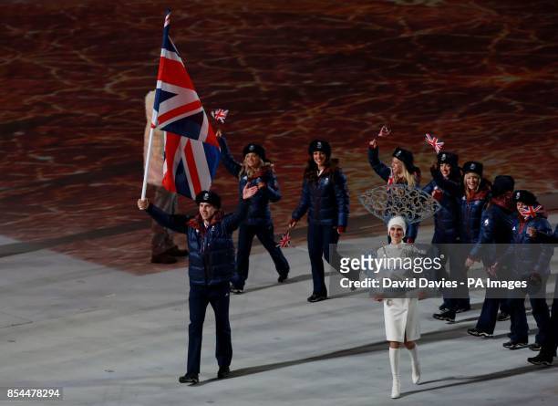 Great Britain's Jonathan Eley leads his team mates out during the Opening Ceremony for the 2014 Sochi Olympic Games in Sochi, Russia.