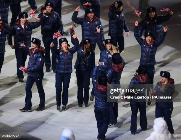 Great Britain athletes wave their flags as they arrive during the Opening Ceremony for the 2014 Sochi Olympic Games at the Fisht Olympic Stadium,...