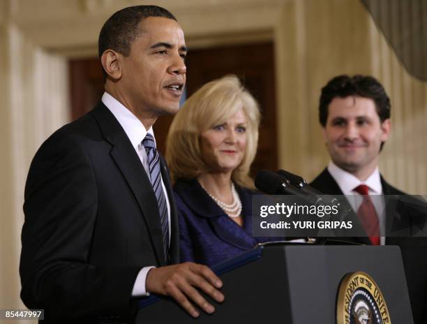 Bank of the West co-founder Cynthia Blankenship and Gia Pronto restaurant founder Marco Lentini listens as US President Barack Obama delivers remarks...