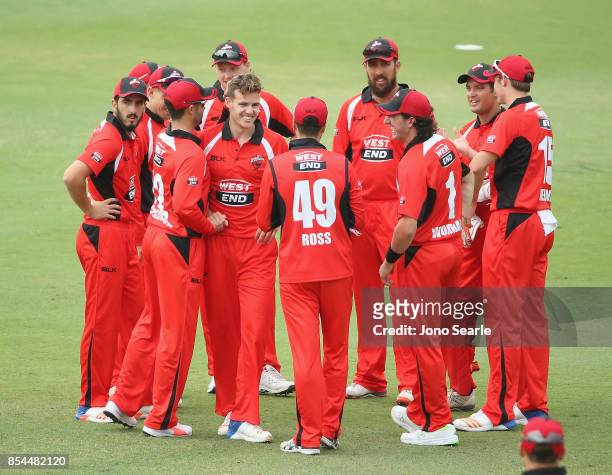 Nick Winter celebrates his wicket with team mates during the JLT One Day Cup match between South Australia and the Cricket Australia XI at Allan...