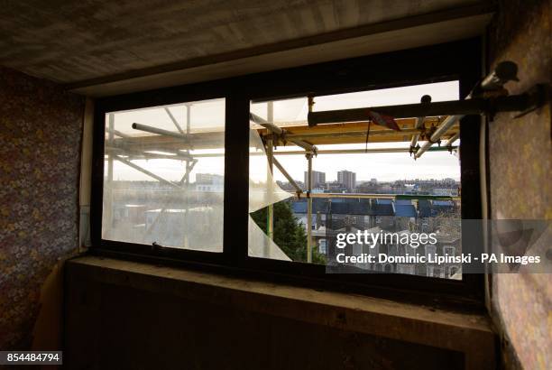 View through a broken window in an empty flat on the Heygate Estate, in Elephant and Castle, in south London, which is in the process of being...