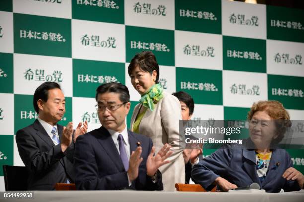 Yuriko Koike, governor of Tokyo and head of the Party of Hope, center, arrives for a news conference in Tokyo, Japan, on Wednesday, Sept. 27, 2017. A...