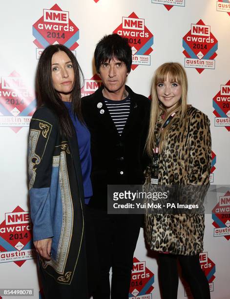 Angie Marr, Johnnie Marr and Sonny Marr arriving for the 2014 NME Awards, at Brixton Academy, London.