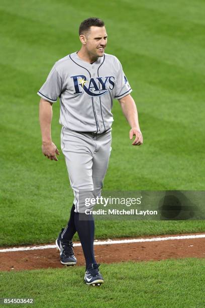 Peter Bourjos of the Tampa Bay Rays walks back to the dug out pitches during a baseball game against the Baltimore Orioles at Oriole Park at Camden...
