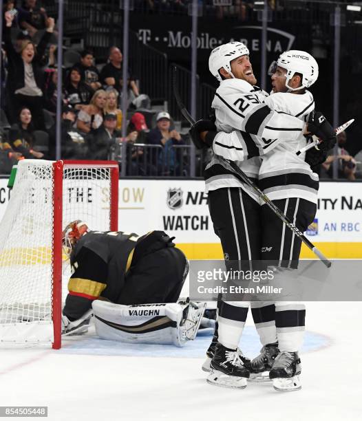 Alex Iafallo of the Los Angeles Kings hugs temmate Brooks Laich after he scored a game-winning goal in overtime against Calvin Pickard of the Vegas...