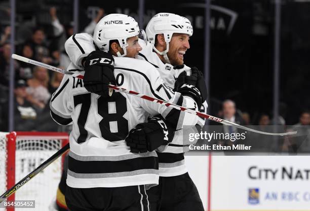 Alex Iafallo of the Los Angeles Kings hugs temmate Brooks Laich after he scored a game-winning goal in overtime against the Vegas Golden Knights...