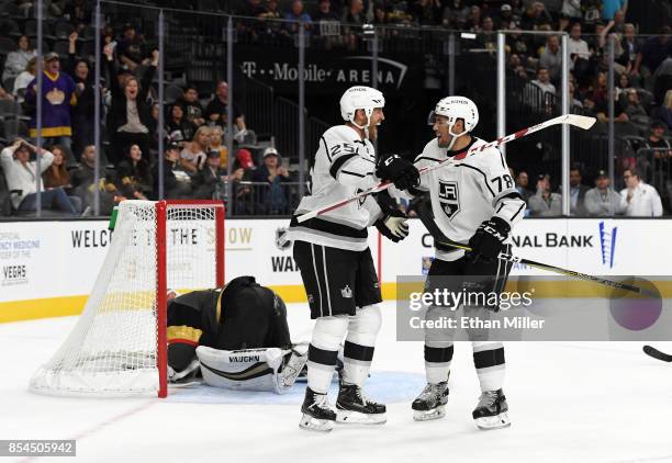 Alex Iafallo of the Los Angeles Kings celebrates with temmate Brooks Laich after he scored a game-winning goal in overtime against Calvin Pickard of...