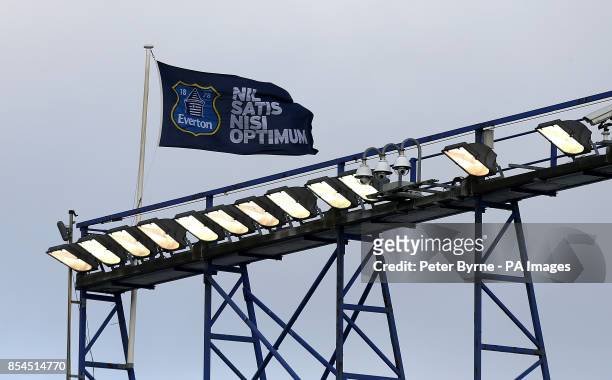 An Everton flag flies high above Goodison Park