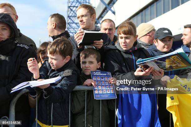 Everton fans wait for autographs outside Goodison Park before the game