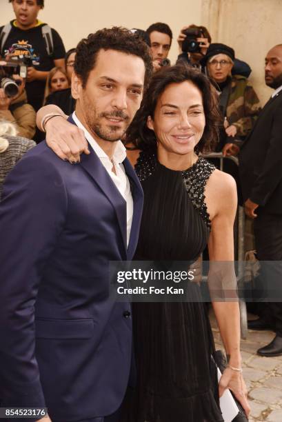 Tomer Sisley and his wife Sandra Zeitoun attends the Christian Dior show as part of the Paris Fashion Week Womenswear Spring/Summer 2018 on September...