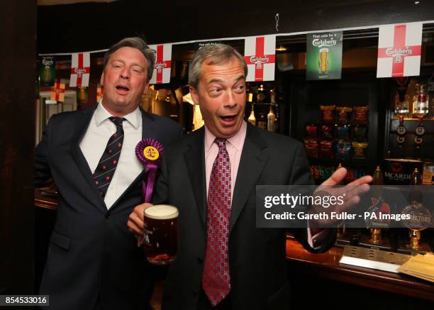 Ukip party leader Nigel Farage enjoys a pint in the Hoy and Helmet Pub in South Benfleet, Essex, as his party make gains across the country following...