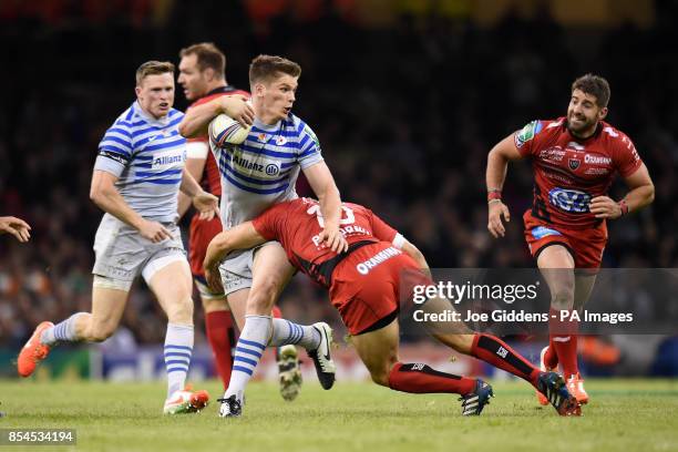 Saracens' Owen Farrell is tackled by RC Toulon's Jonny Wilkinson during the Heineken Cup Final at the Millennium Stadium, Cardiff.