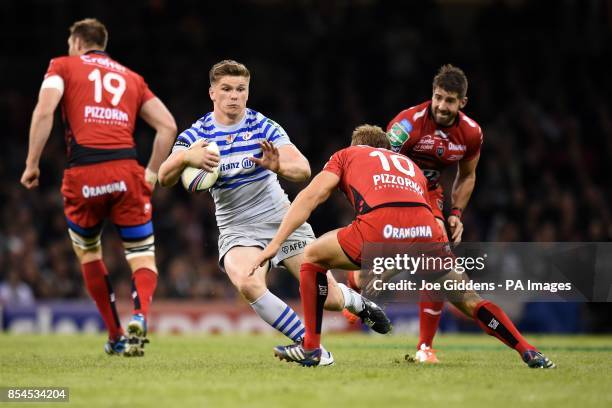 Saracens' Owen Farrell runs at RC Toulon's Jonny Wilkinson during the Heineken Cup Final at the Millennium Stadium, Cardiff.