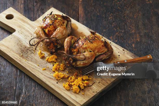 pumpkin and quinoa stuffed quails - pollo asado fotografías e imágenes de stock