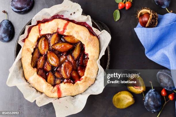 rustic plum tart - tart dessert stock pictures, royalty-free photos & images