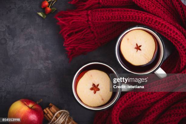 mulled wine with apple slices - winter scarf stock pictures, royalty-free photos & images