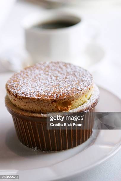 vanilla souffle with powdered sugar in ramekin - souffle stock pictures, royalty-free photos & images