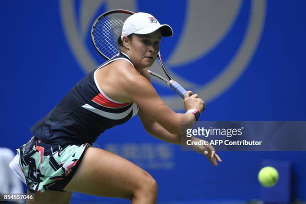 Ashleigh Barty of Australia hits a return against Agnieszka Radwanska of Poland during their third round women's singles match at the WTA Wuhan Open...