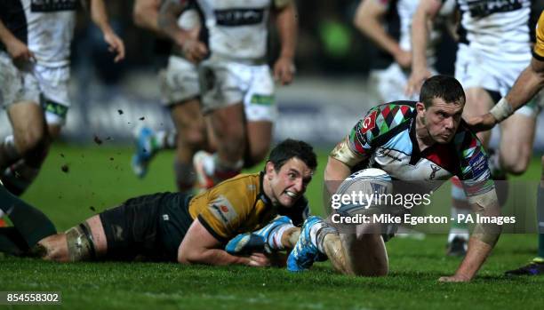 Northampton Saints' Calum Clark tackles Harlequins' Tim Molenaar during the Amlin Challenge Cup, Semi Final match at Franklins Gardens, Northampton.