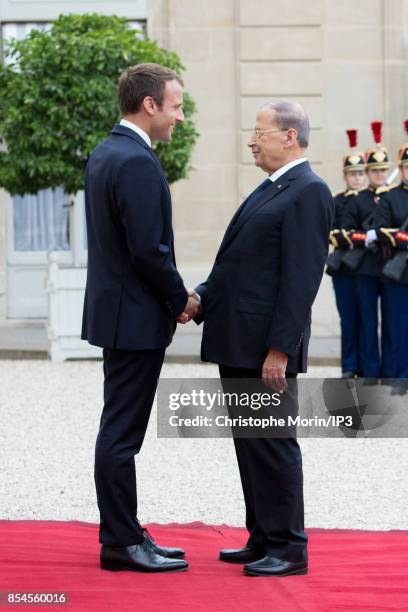 French President Emmanuel Macron welcomes Lebanese President Michel Aoun at the Elysee Palace on September 25, 2017 in Paris, France. Aoun made a...