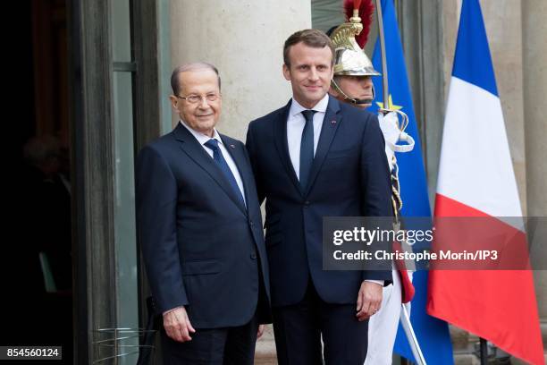 French President Emmanuel Macron welcomes Lebanese President Michel Aoun at the Elysee Palace on September 25, 2017 in Paris, France. Aoun made a...