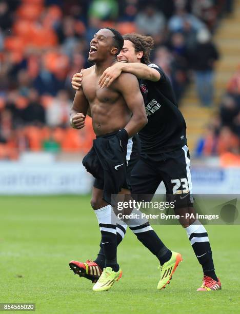 Charlton Athletic's Callum Harriott celebrates his goal with Lawrie Wilson during the Sky Bet Championship match at Bloomfield Road, Blackpool.