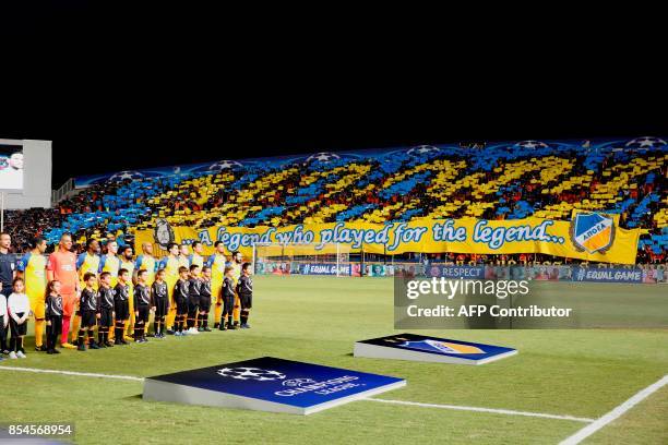 Apoel FC's supporters cheer during the UEFA Champions League football match between Apoel FC and Tottenham Hotspur at the GSP Stadium in Nicosia on...