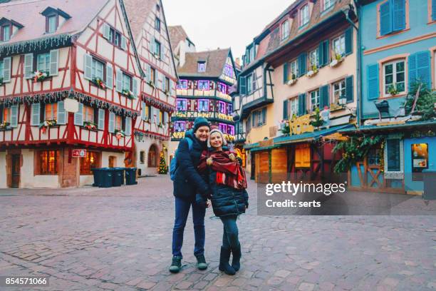 young couple enjoying in colmar, france - strasbourg winter stock pictures, royalty-free photos & images