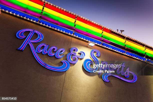 neon lights of the rainbow casino in west wendover nevada - wendover stock pictures, royalty-free photos & images