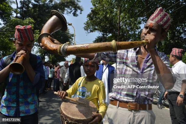 Indian Nepali Hindus celebrate during the Fulpati procession marking the seventh day of the Dasain festival in Siliguri on September 27, 2017. The...