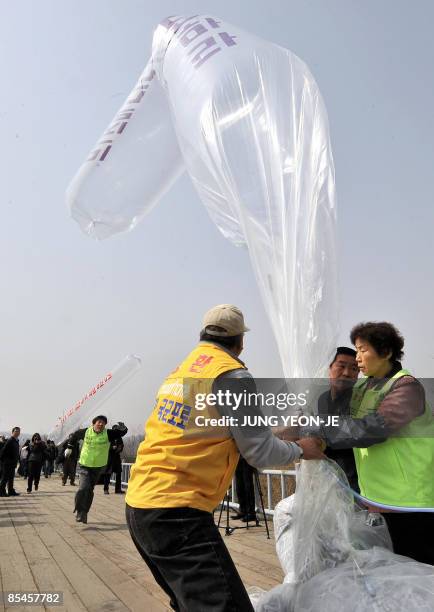 South Korean activists prepare to float balloons carrying anti-Pyongyang leaflets and North Korean banknotes across the border into North Korea at...