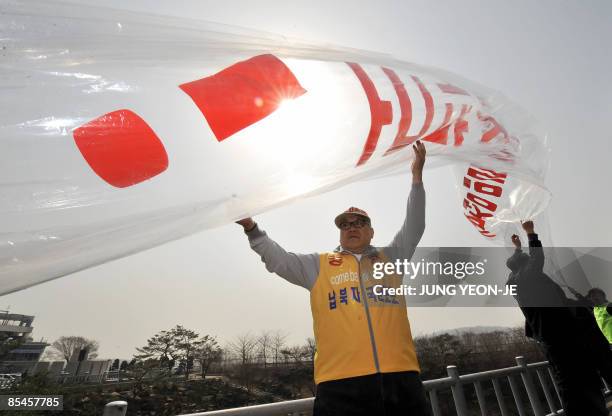 South Korean activists prepare to float balloons carrying anti-Pyongyang leaflets and North Korean banknotes across the border into North Korea at...