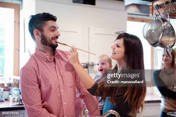 holiday season family multi-generation preparing thanksgiving dinner - mashed potatoes stock pictures, royalty-free photos & images