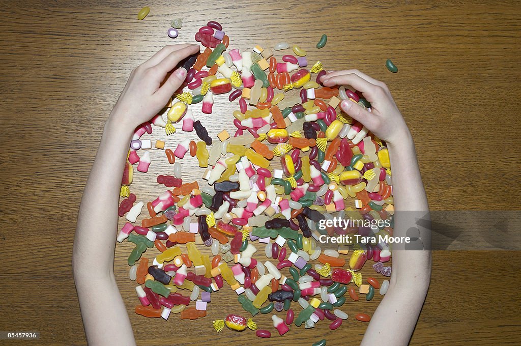 Hands gathering sweets