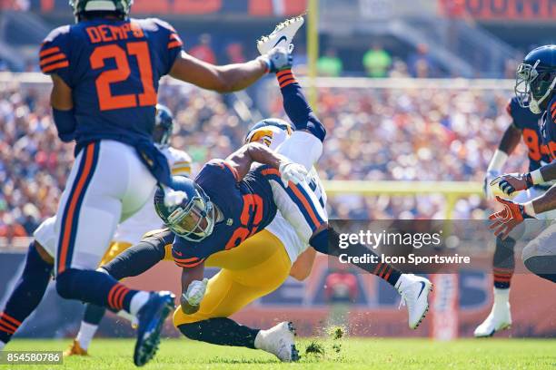 Chicago Bears cornerback Kyle Fuller collides with Pittsburgh Steelers tight end Jesse James to make a tackle during an NFL football game between the...