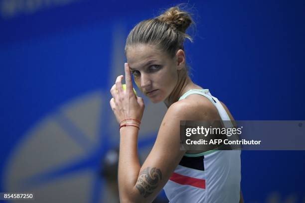 Karolina Pliskova of Czech Repubic reacts before serving against Wang Qiang of China during their third round women's singles match at the WTA Wuhan...