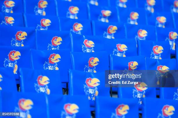 Kansas Jayhawks logo are seen on seatbacks at prior to a game against the West Virginia Mountaineers Memorial Stadium on September 23, 2017 in...
