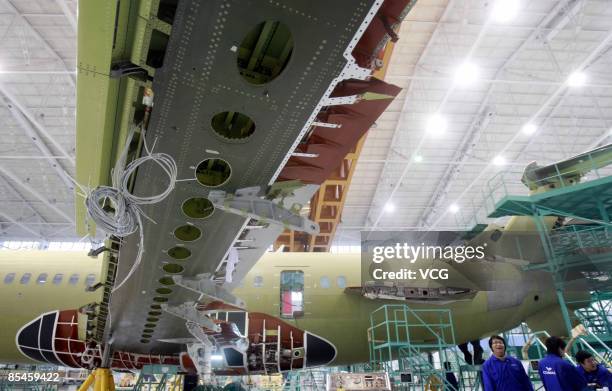 China's first domestically designed and produced passenger jet, the ARJ21, is seen on a production line at a Shanghai Aircraft Manufacturing factory...